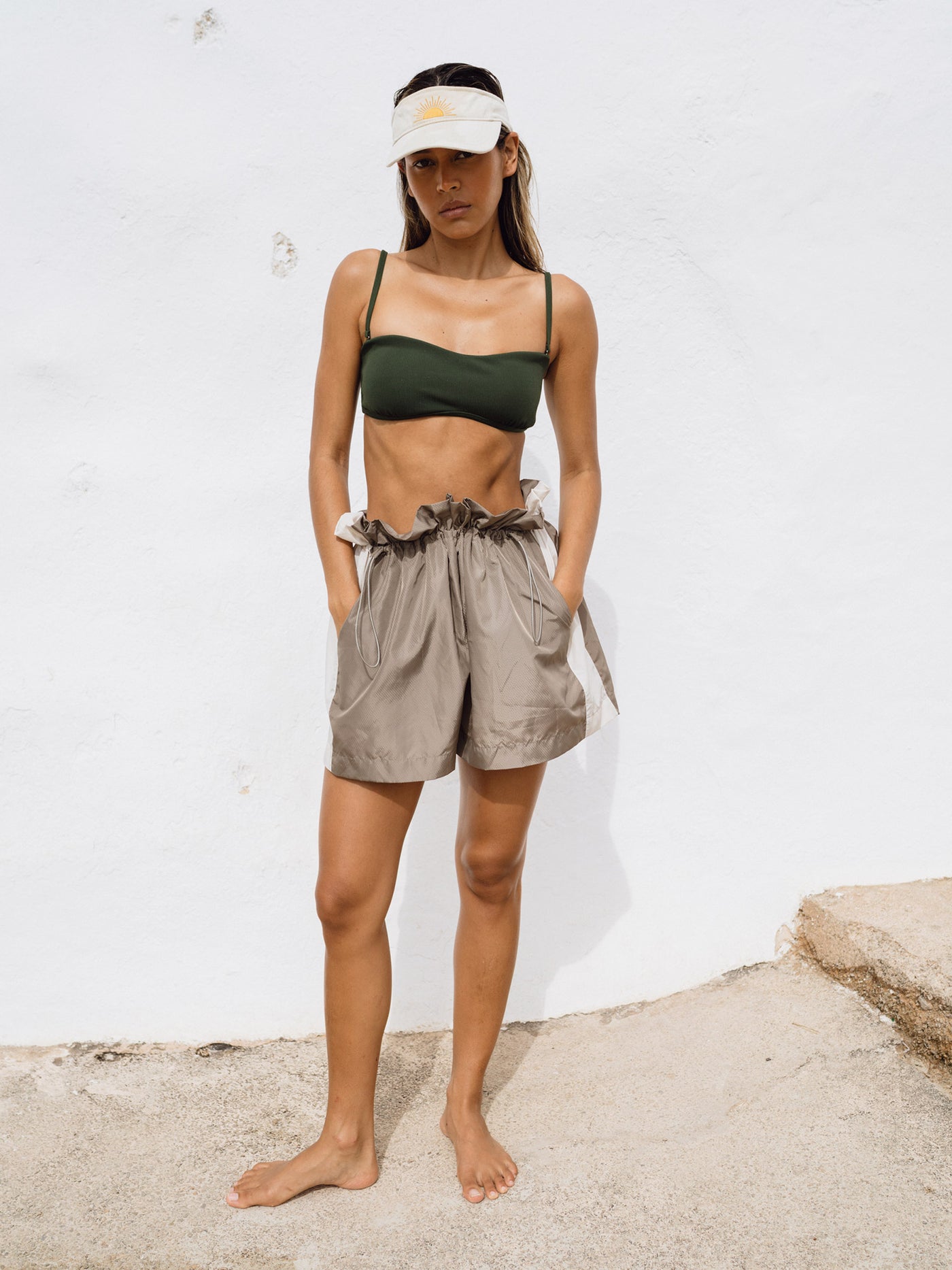 Underprotection track shorts in brown, green and white made from 100% polyester (recycled)