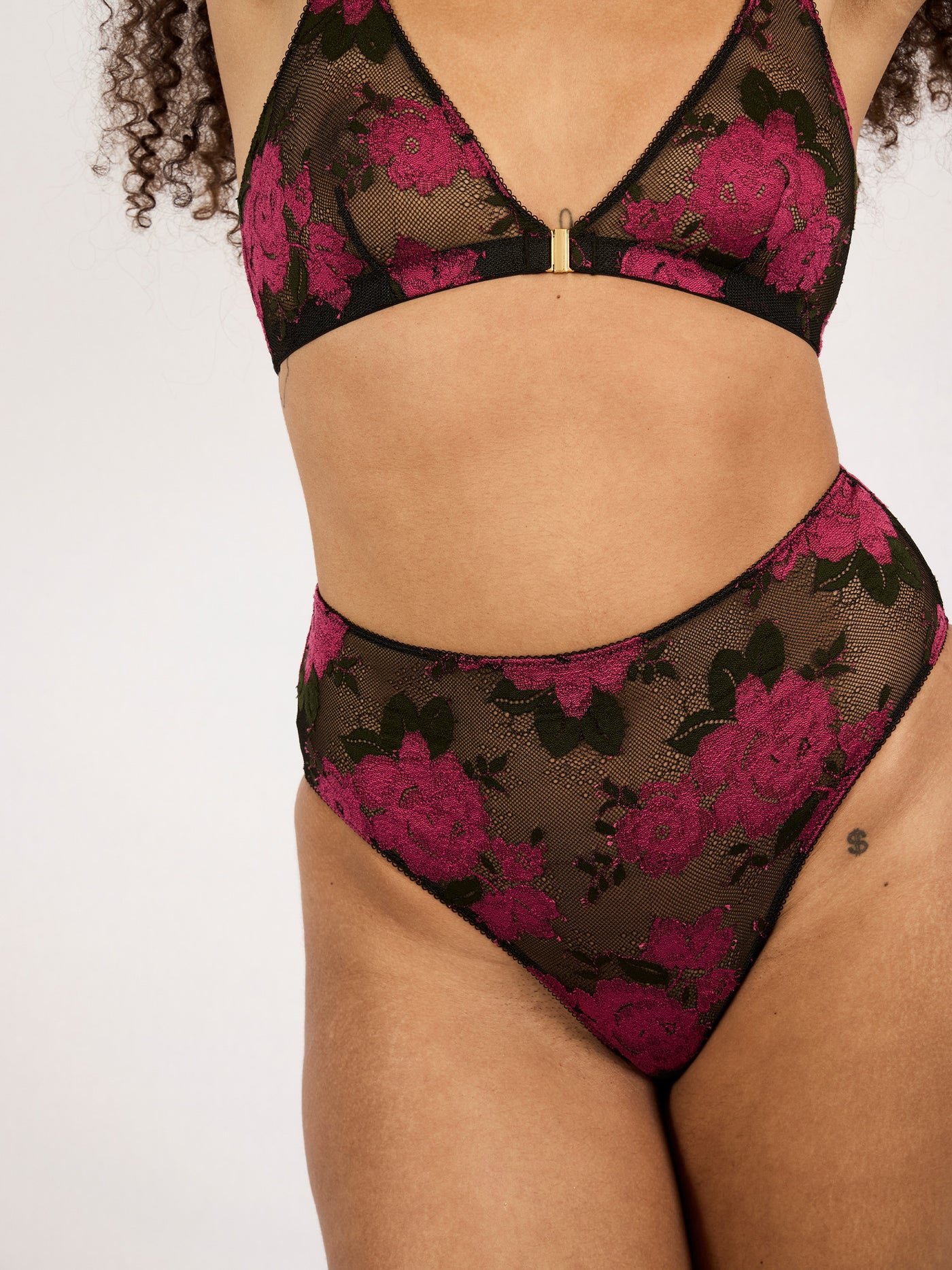 Underprotection high briefs in black with a flower design made from recycled polyamide